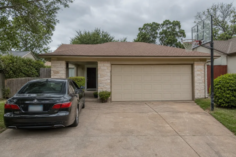 A house with an attached garage in Irving, TX